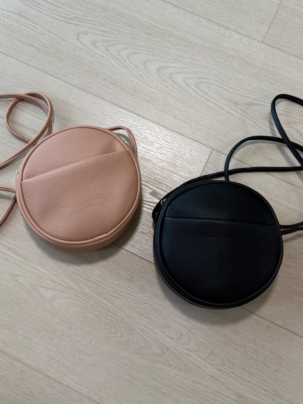 2 Round Crossbody Bags in Blush and Black
